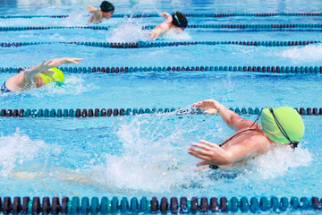 Women's Butterfly race, focus on center lane line, some motion blur