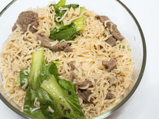 delicious instant noodle in bowl on white background