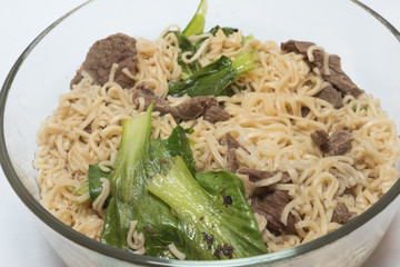 delicious instant noodle in bowl on white background