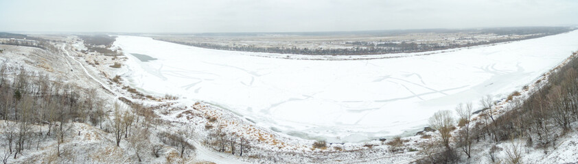 Fototapeta na wymiar Aerial view of snow covered countryside