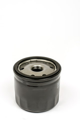 Black metal car oil filter isolated over white background