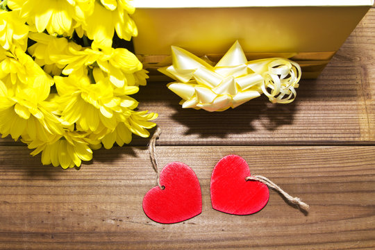 Gift box and yellow flowers with labels