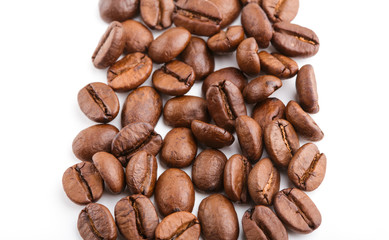 roasted coffee beans isolated in white background. Roasted coffee beans background close up. Coffee beans pile from top on white background with copy space for text. Good morning.