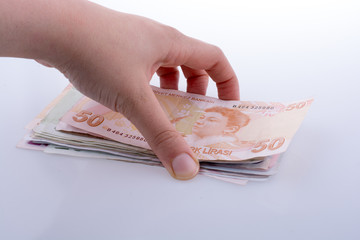 Hand holding Turksh Lira banknotes  in hand
