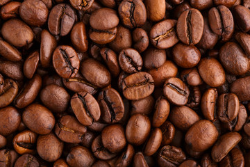 roasted coffee beans isolated in white background. Roasted coffee beans background close up. Coffee beans pile from top on white background with copy space for text. Good morning.