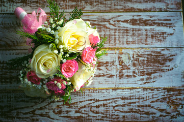 bridal bouquet and newlyweds rings.