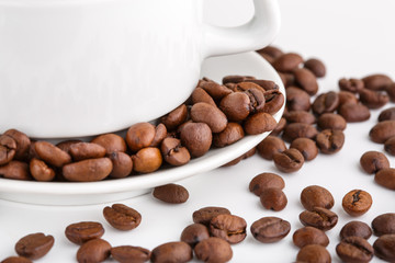 roasted coffee beans isolated in white background. Roasted coffee beans background close up. Coffee beans pile from top on white background with copy space for text. Good morning.