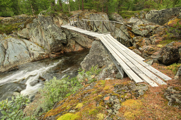 Wooden bridge at the river Inna, Norway