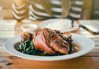 Young Hipster Asian Woman are Enjoy Eating Yunnan Stewed Pork