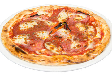 Pizza on a white background with tenderloin, cheese, tomato sauce, spices and chili pepper.