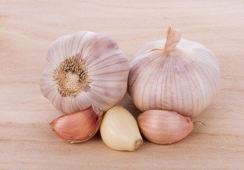 Garlic isolated on wooden background