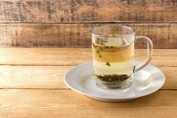 Green tea in a transparent mug