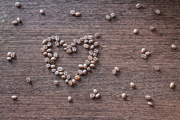 Roasted coffee beans in shape of heart