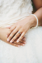 Young brides hands with wedding ring