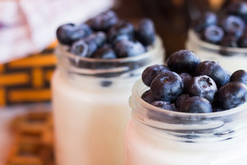 Yogurt with berries in a glass jar