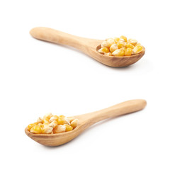 Wooden spoon filled with corn