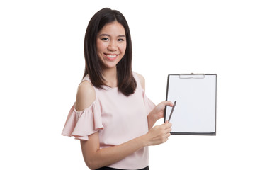 Happy Asian business woman point to clipboard with pen.