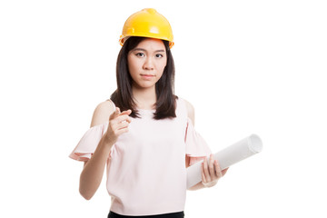 Asian engineer woman pointing with blueprints.