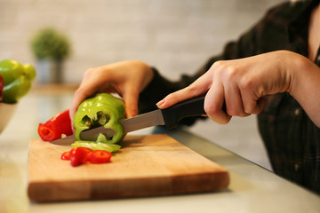 Obraz na płótnie Canvas Close up of woman hand preparing vegetable.