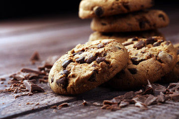 Chocolate cookies on wooden table. Chocolate chip cookies shot