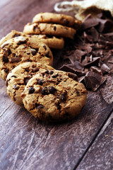 Chocolate cookies on wooden table. Chocolate chip cookies shot