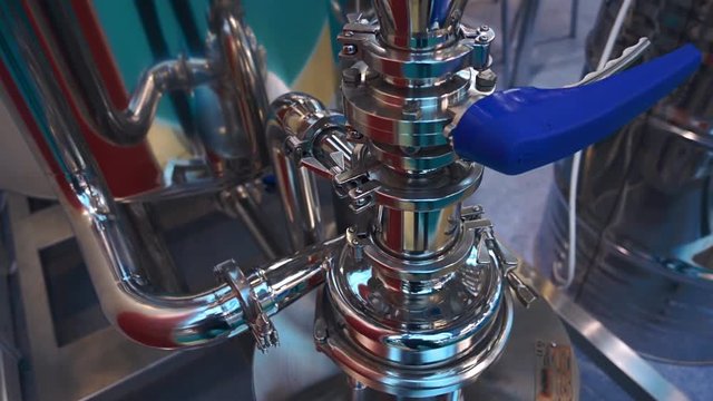 Shiny chrome unit of technological equipment of high-tech manufacturing. Shot in motion