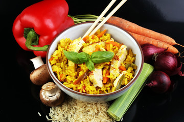 Homemade Chinese fried rice with vegetables, chicken and fried e