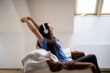 young woman listen music at home and relax