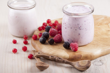 Smoothies with frozen berries red currants, black currants and r