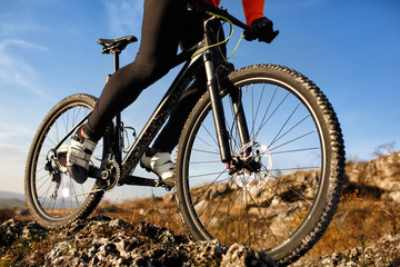 Fototapeta premium Biker riding on a background of blue sky.