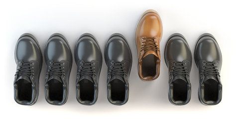 One unique brown boot in the row of black boots. Marketing conce