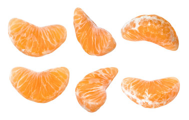 Mandarine slice shot on different point of view. Isolated on white background without shadow. Set of ripe mandarine slice. Closeup shot. Macro photography. Close-up photography of mandarine slice.