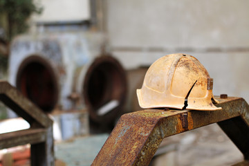 Old security helmet at an abandoned factory © renatoromani