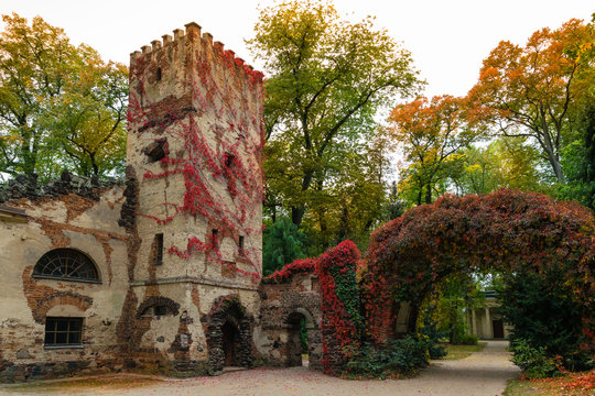 Arkadia, Poland - September 30, 2016: Burgrave's house and stone arch in the  sentimental and romantic Arkadia park,  near Nieborow, Central Poland, Mazovia. Garden in the English style