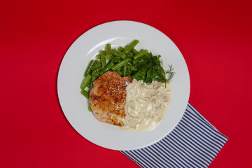 Top view of plate with grilled steak and french green bean with