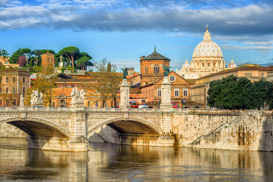 Tiber bridge and Dome of Vatican cathedral, Rome, Italy