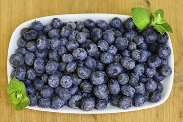 Blueberries on wooden deck from above