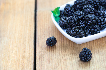 Blackberries on wooden deck with lines
