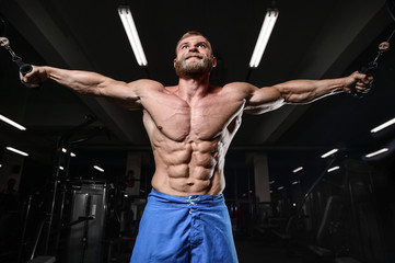 Fototapeta na wymiar brutal muscular man with beard unshaven fitness model healthcare