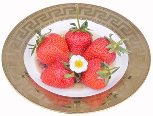 isolated strawberries on the plate