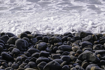 Pebble beach. Stones and water