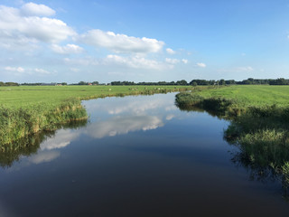 Fototapeta na wymiar Lake with reflection in Friesland