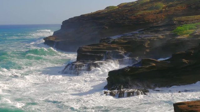 Powerful waves of ocean hitting cliff Lanai Lookout East Oahu, Hawaii