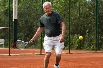 Zelfklevend Fotobehang Senior tennis player © Microgen