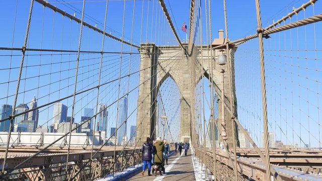 NEW YORK - JANUARY 15: Pedestrians walk over the Brooklyn Bridge, New York