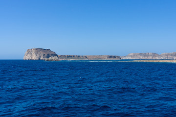 Fototapeta na wymiar Seascape. View from the sea on the west coast of Crete. Greece.