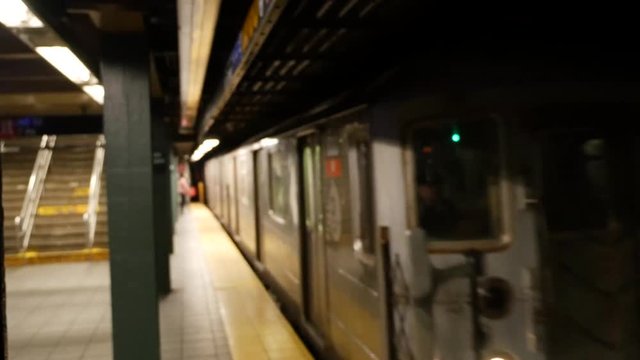 Times Square Subway, NYC -  a subway train arriving at 42 street subway station
