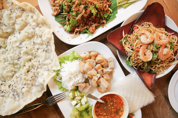 Four of Vietnamese dishes on wood table