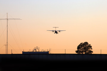Fototapeta na wymiar silhouette of a propeller aircraft in sky