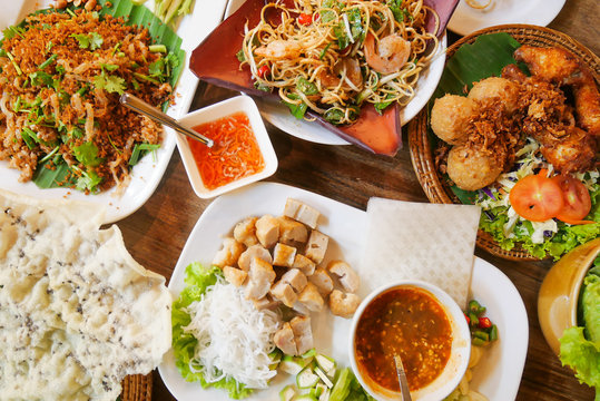 Five Of Vietnamese Dishes On Wood Table